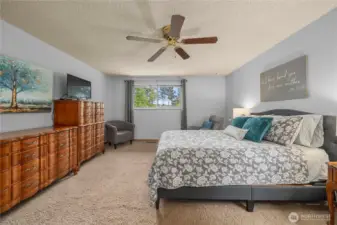 Large window overlooking the front yard! Plenty of space for a King Bed, currently contains a queen.