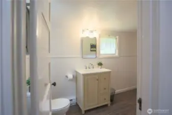 Cute half bath and laundry room off the second bedroom.