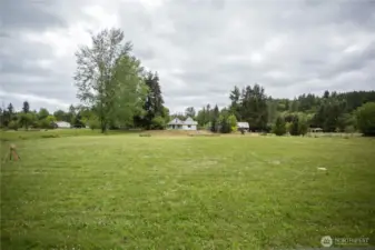 This home is on a corner lot.  This is looking up at the house from the lower field.