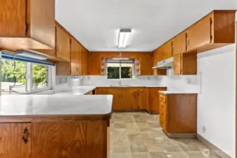 Kitchen has wood cabinets.
