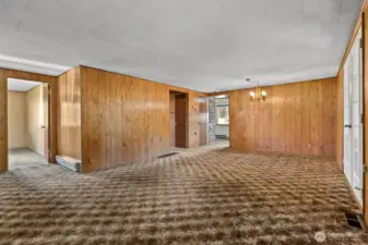 Spacious Living room and dining room area is carpeted.