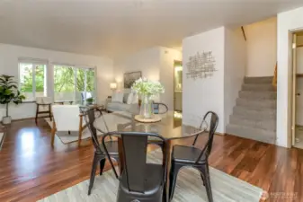 This angle shows the staircase leading to the extra bedrooms and full bathroom. The half bathroom is off the family room and leads to the primary bedroom , ensuite and walk in closet.