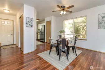 Kitchen has updated stainless steel fridge and dishwasher.