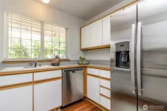 Updated stainless steel dishwasher and fridge.