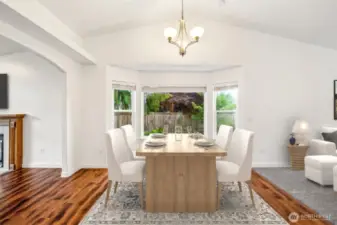 This spacious Eating Area allows for easily gathering with you favorite guests, whilE still being a part of the conversation in the Family Room and/or the Livings Room. Virtually srtaged.