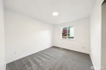 Bedroom #2 is spacious and overlooks the side of the home.