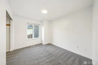 Bedroom #3 is spacious and overlooks the side of the home.