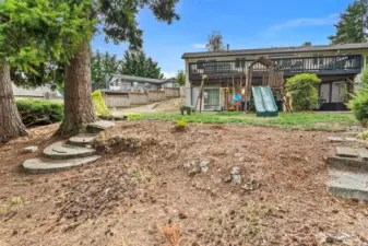 Fully fenced yard with gates on either side