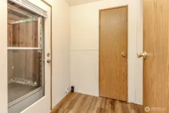 W/D hook ups in this room off the kitchen. This back door leads to the covered deck