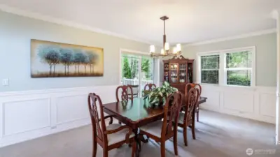 This formal dining space flows seamlessly to the outdoor seating area for effortless entertaining.