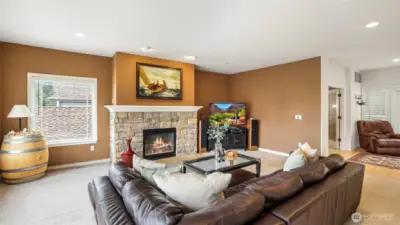 Recessed lighting illuminates this warm and inviting living space, creating the perfect ambiance day or night