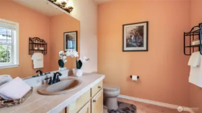 Well-appointed spare bath with modern fixtures and fresh finishes