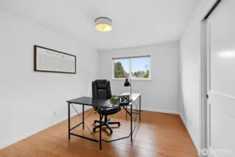 Flexible main floor room for guests or office.