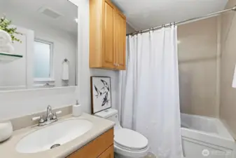 Primary bath with a tub/shower combo.