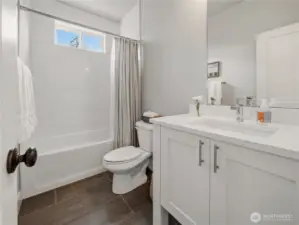 Main floor full bathroom situated directly across from the second main floor bedroom which makes it perfect for guests or the convenience of 2 bedrooms on the main level.