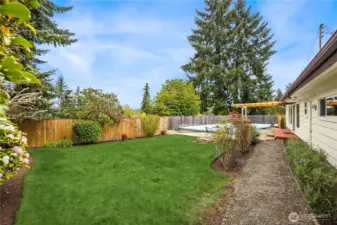 Step through the sliding glass door to the fully fenced back yard with patio and level play lawn.