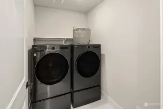 Upper level laundry space.