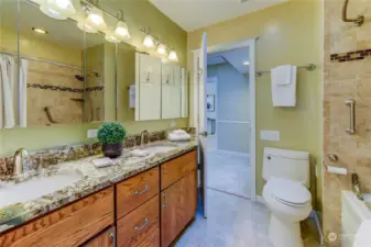 Bathroom on mainfloor has double sinks and storage.