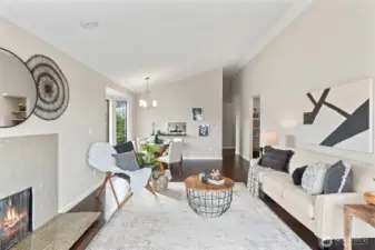 The living room flows seamlessly to a dining area.