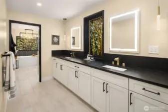 Spa bathroom divided into counter space and vanity...