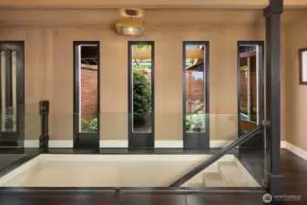 Architectural details overlooking the courtyard/interior garden. The owners replaced the wood post railing by a glass one to let the light in.