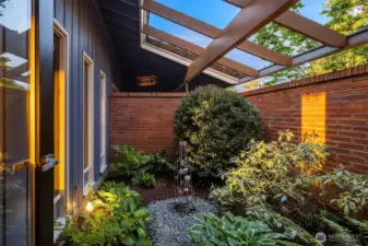 Delightful detail from the dining room & hallway: an interior courtyard/garden.