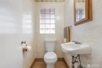 Half-bath off oversized utility/ mudroom has potential to expand to a 3/4 or full bath if desired.