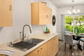 Sliding doors add light and the garden view to the kitchen area