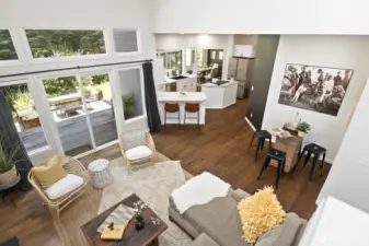 From the stairs you can get a complete view of the main living spaces thanks to the vaulted ceilings and open layout.