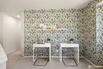 This versatile loft space at the top of the stairs can be used for a variety of activities, all backed by this stylish and wallpaper.