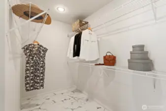 The new tile flooring continue into the walk-in closet, which has abundance space for all your apparel.
