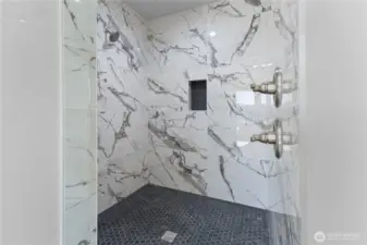 Primary Suite Double headed shower with bench