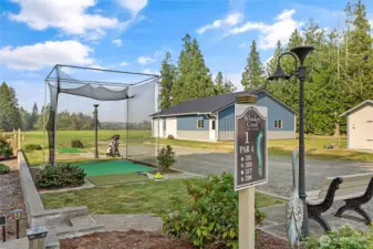 Golf anyone? Well maintained property featuring your very own golf practice net & putting green