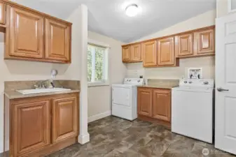 Huge utility/multi-purpose room w/tons of built in cabinets