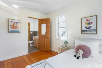 Main floor, first bedroom with adjoining full bathroom.