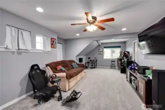 Game room above the garage with large storage closet