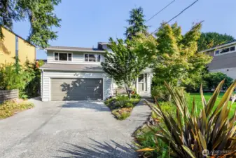 South facing home w/ oversized driveway & easy-stroll entry sidewalk