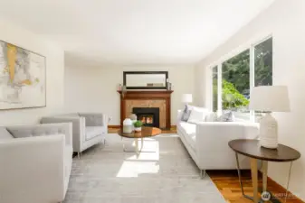 Step inside to sunny living room w/ Jotul woodstove to keep you cozy all winter. Custom marble face & mantel centers you while you relax