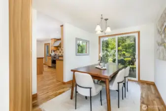 Dining room enjoys backyard views & access