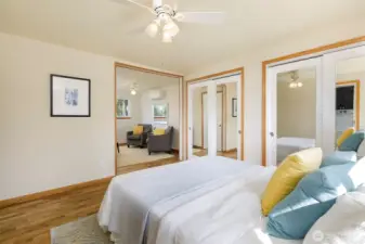 View towards dressing/sitting area & 2 custom closet areas w/ organizer shelves inside