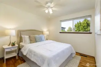Guest bedroom w/ backyard views