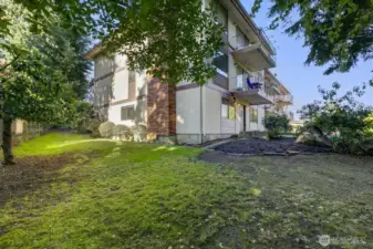 Side view of unit showing very private side yard just a couple steps from your front door.
