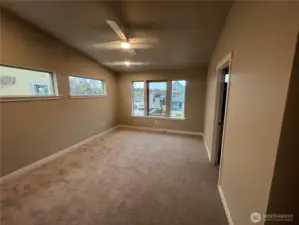 Another view of the primary with door to right leading to the ensuite