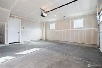 Spacious 2 car garage included garage door opener with app and Ev charger outlet.