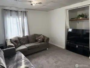 large living room with inset for TV or closet space