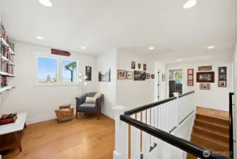 Up the stairs to bedrooms, laundry and this sweet book nook area!