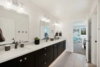 Jack and Jill bath. 3 sinks yes! it's not a trick of the camera. So much room and storage in this space.