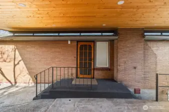 Wood-wrapped 2-car carport and paver parking pad