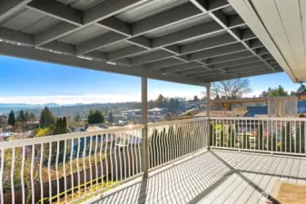 Experience incredible views with this covered Trex-style deck built for outdoor living and grilling