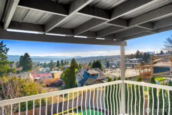 Experience incredible views with this covered Trex-style deck built for outdoor living and grilling